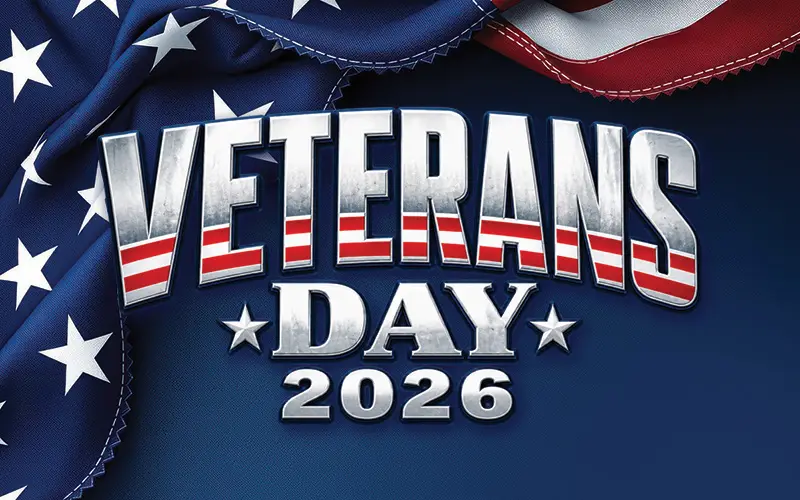 Veterans Day 2026 graphic featuring bold metallic silver lettering with red and white stripes, white stars, and a draped American flag against a dark navy blue background.