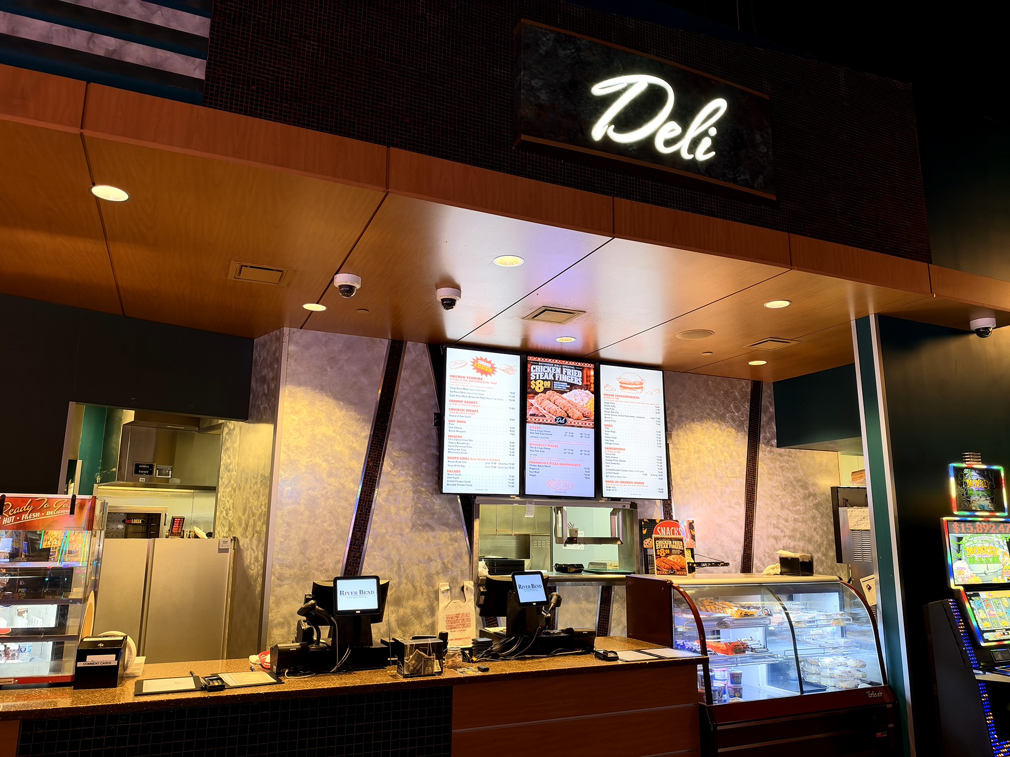 River Bend Casino Deli service counter, illuminated Deli sign, and food display cases